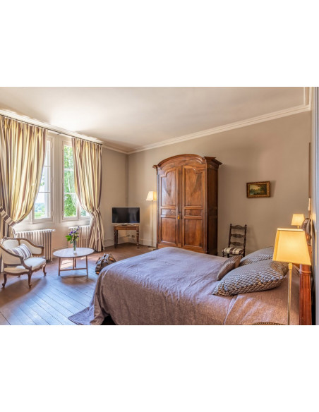 Chambre de grand confort avec ambiance intimise et sa vue sur le vignoble !